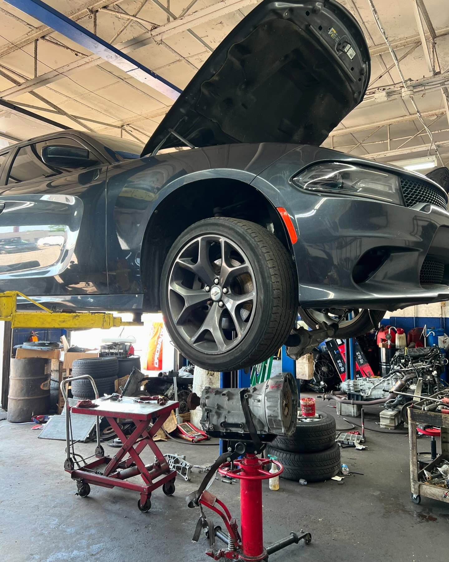Vehicle being serviced inside John's Auto Experts